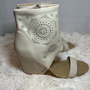 Koolaburra Perone laser detail open toe leather wedge heels.